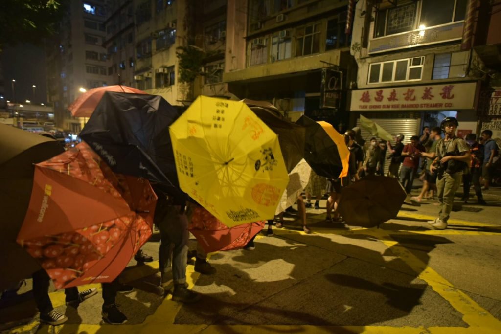 Umbrella movement protesters with umbrellas