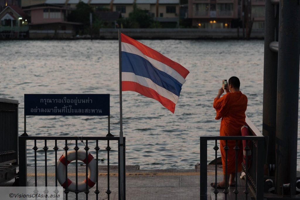 monk shoots sunset