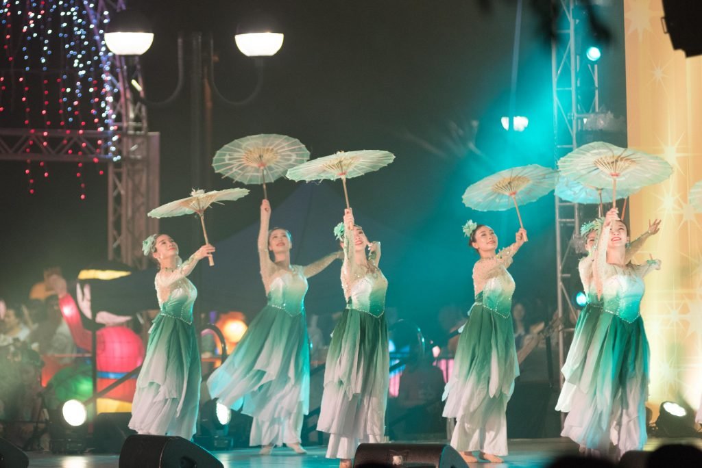 Traditional umbrella dancers