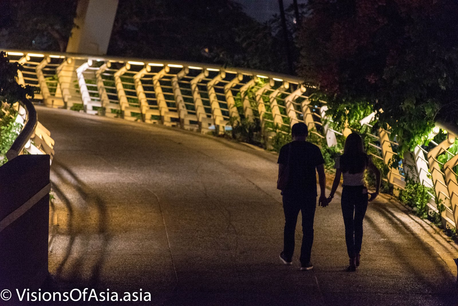 Couple on overpass of Love River