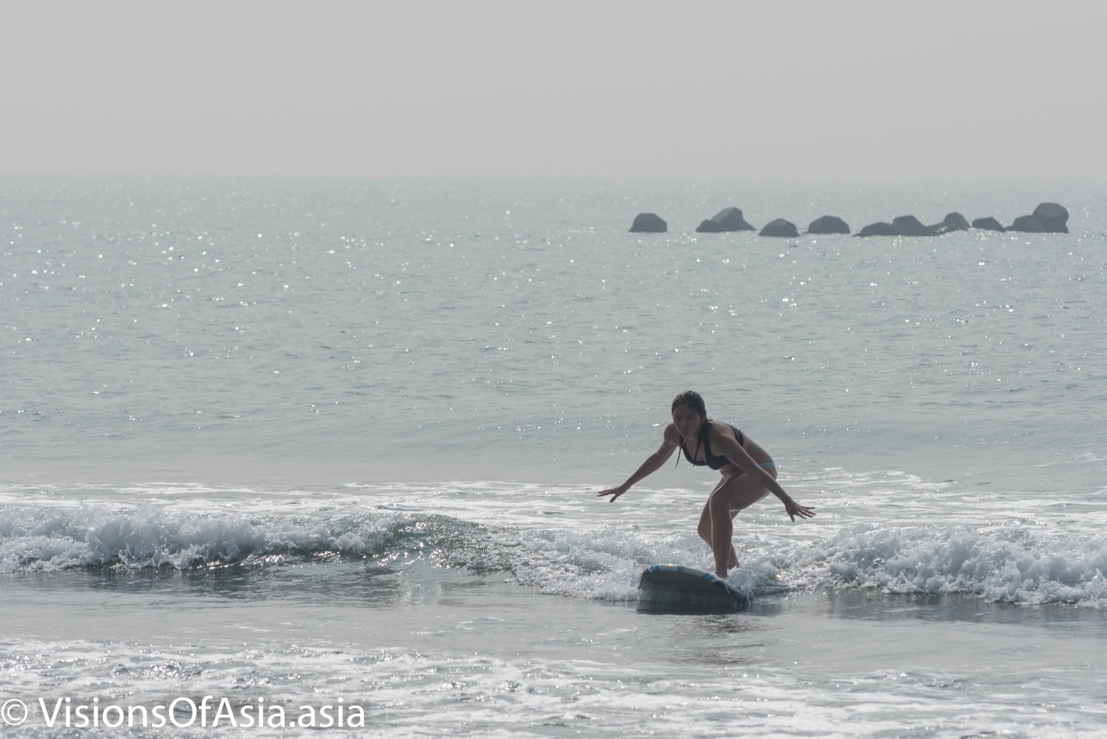 Surfer on Cinjin island