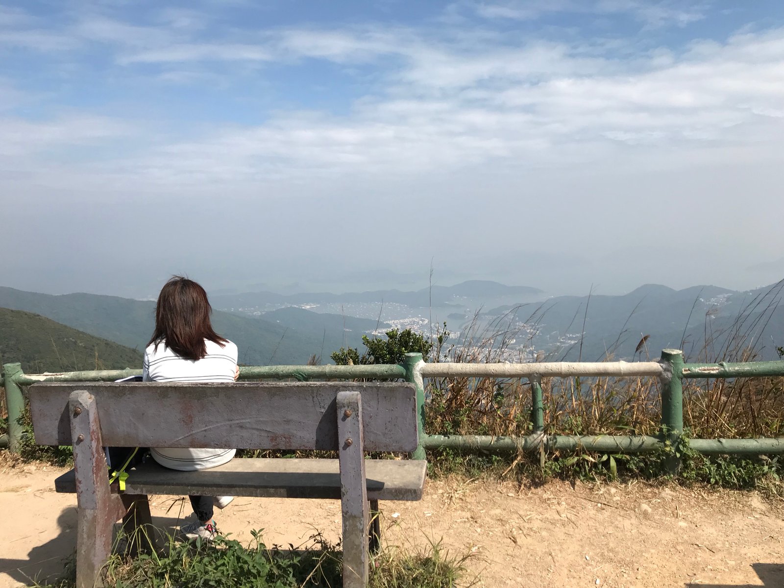 A lady looks on Sai Kung from the Kowloon peak observation point