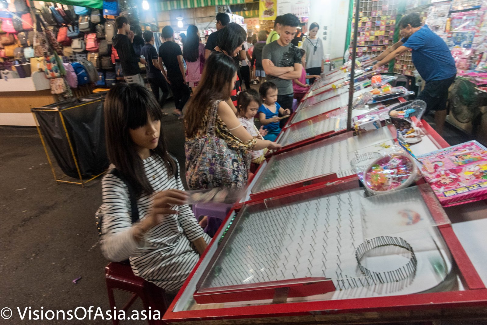Playing games at Ruifeng Night market