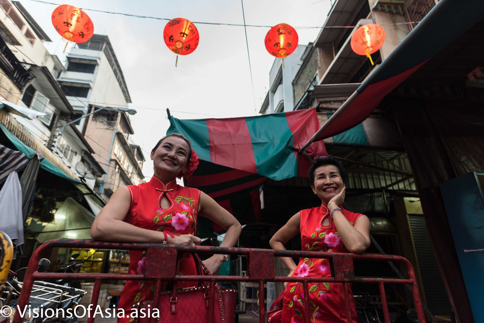 Two ladies in red Quipao