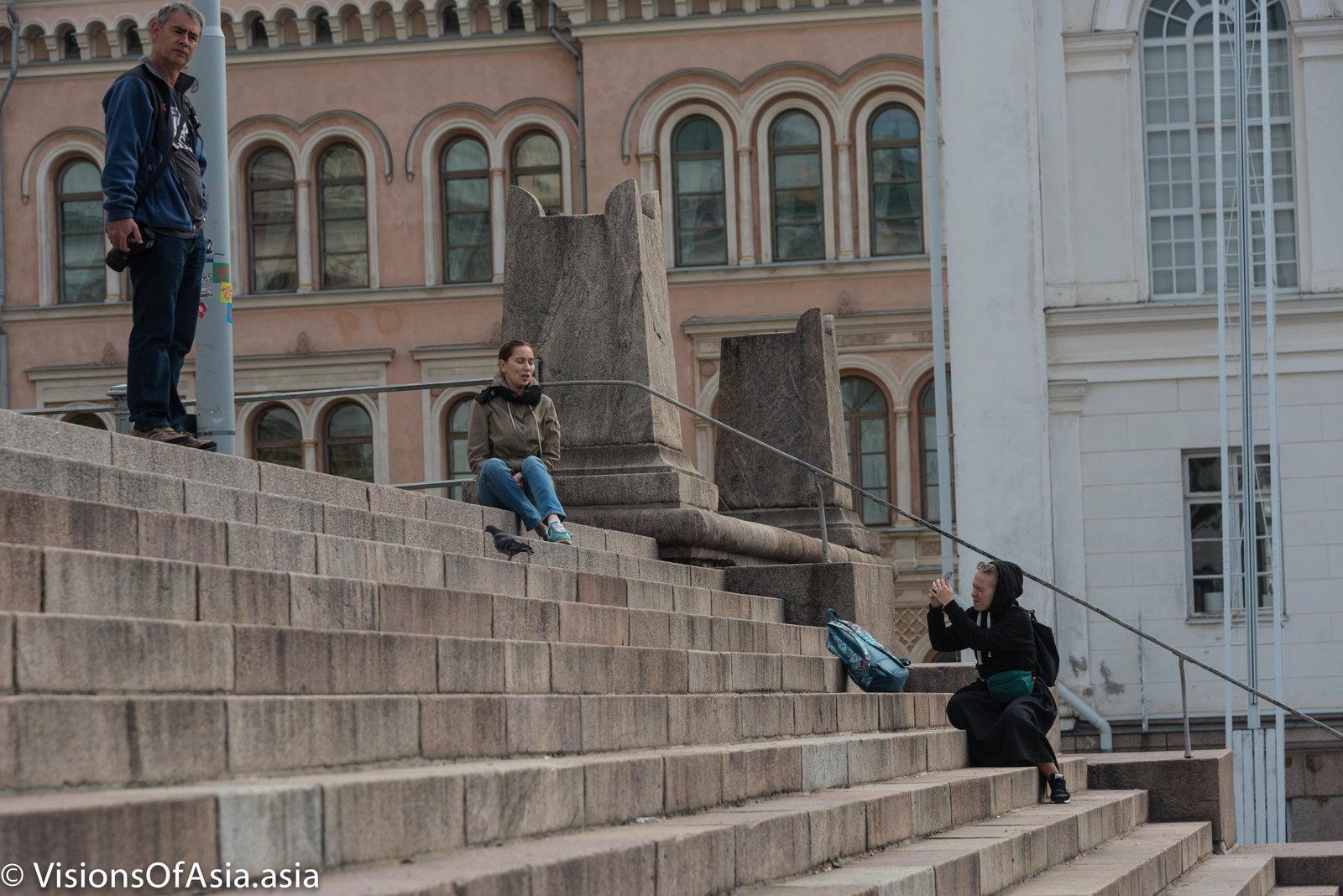Two girls on the stairs of Tuomiokirkko.