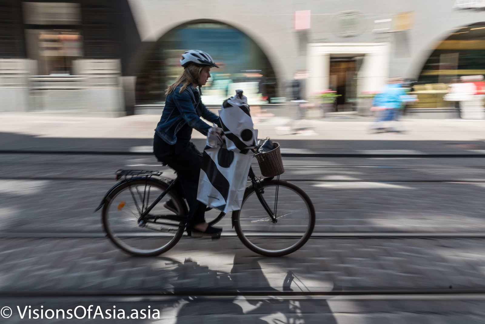 Finnish lady on bicycle in Helsinki