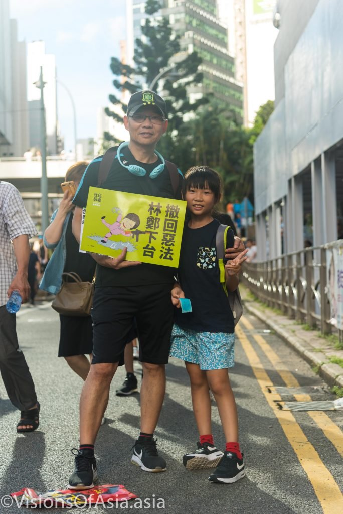 Father and daughter protest against extradition bill