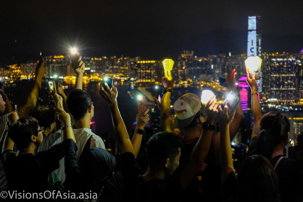 Protesters hold up their lanterns on the Peak