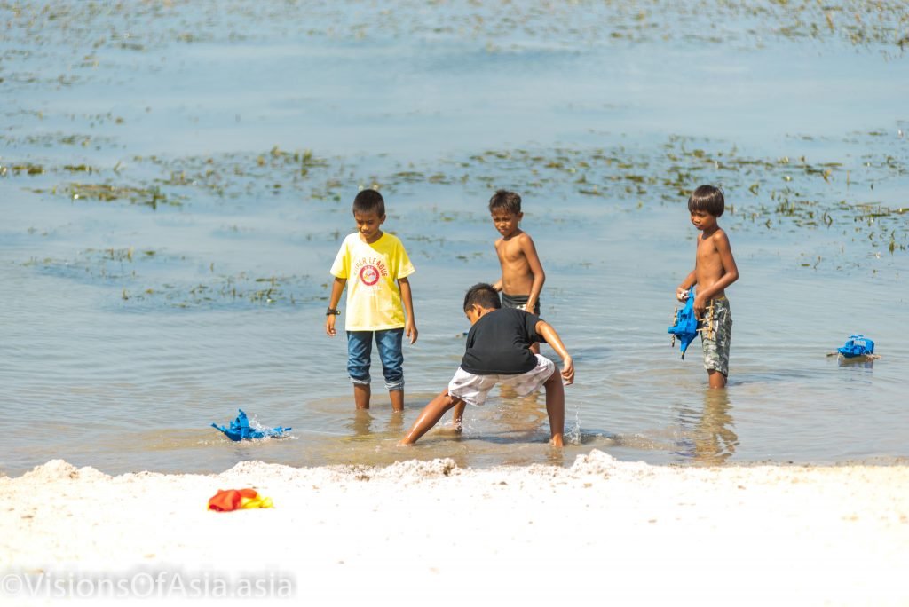 children playing in the sea