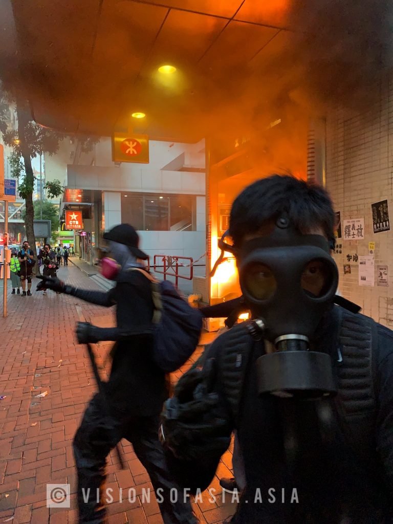 Protesters escape as a blaze consumes Wanchai station