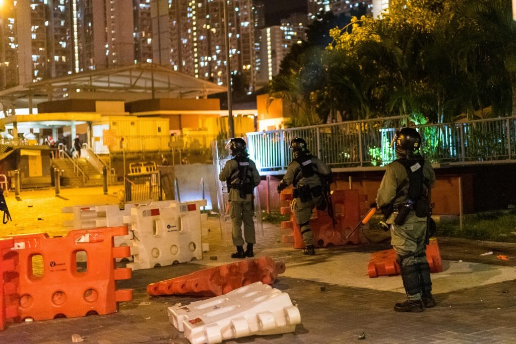 Riot police descend from overpass to scare protesters