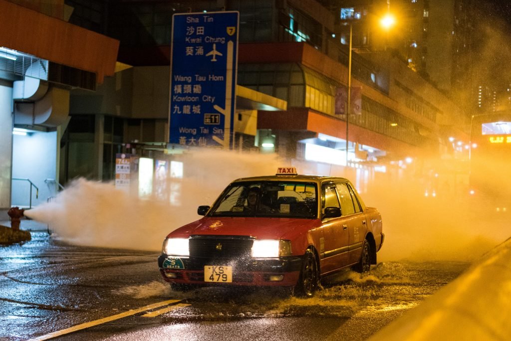 A fire hydrant floods the street