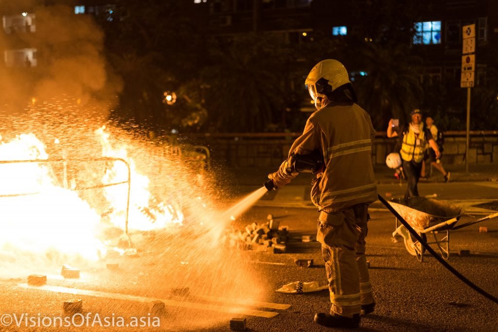 A fireman extinguishes the blaze in Wong Tai Sin