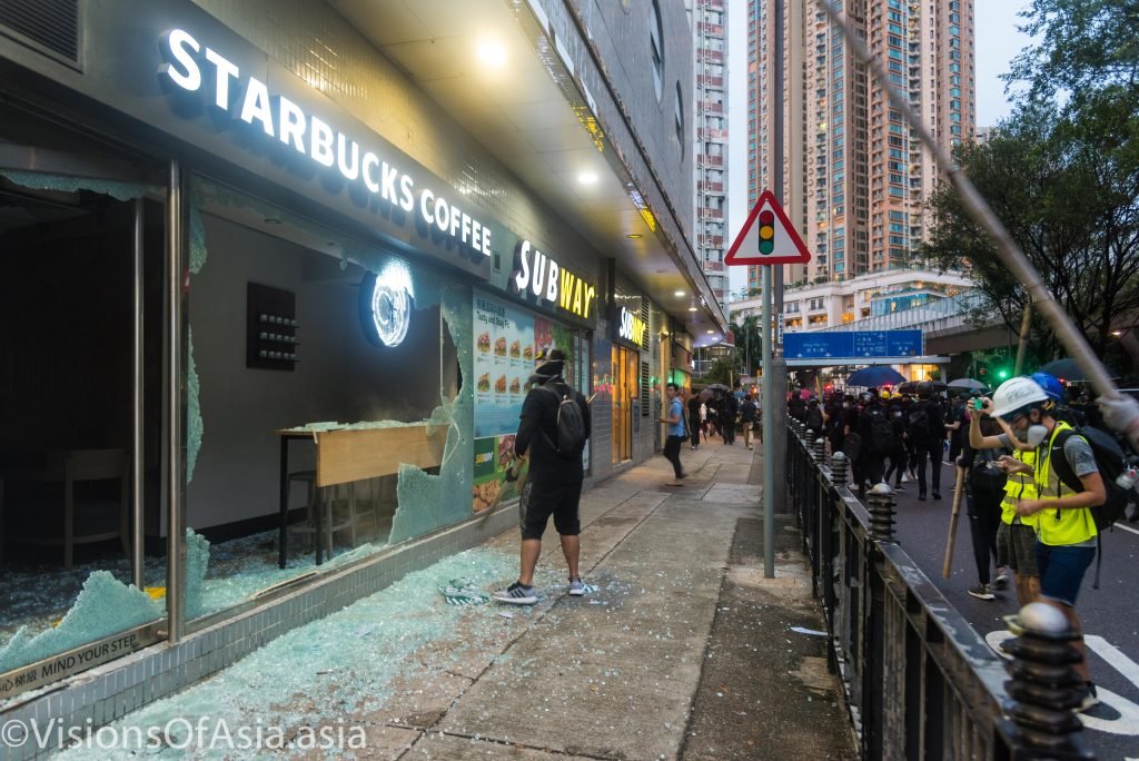 Protesters destroy a Starbucks