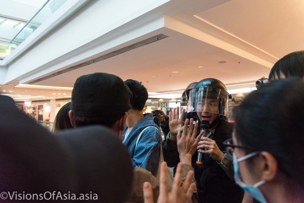 Police commander tries to reason with protesters