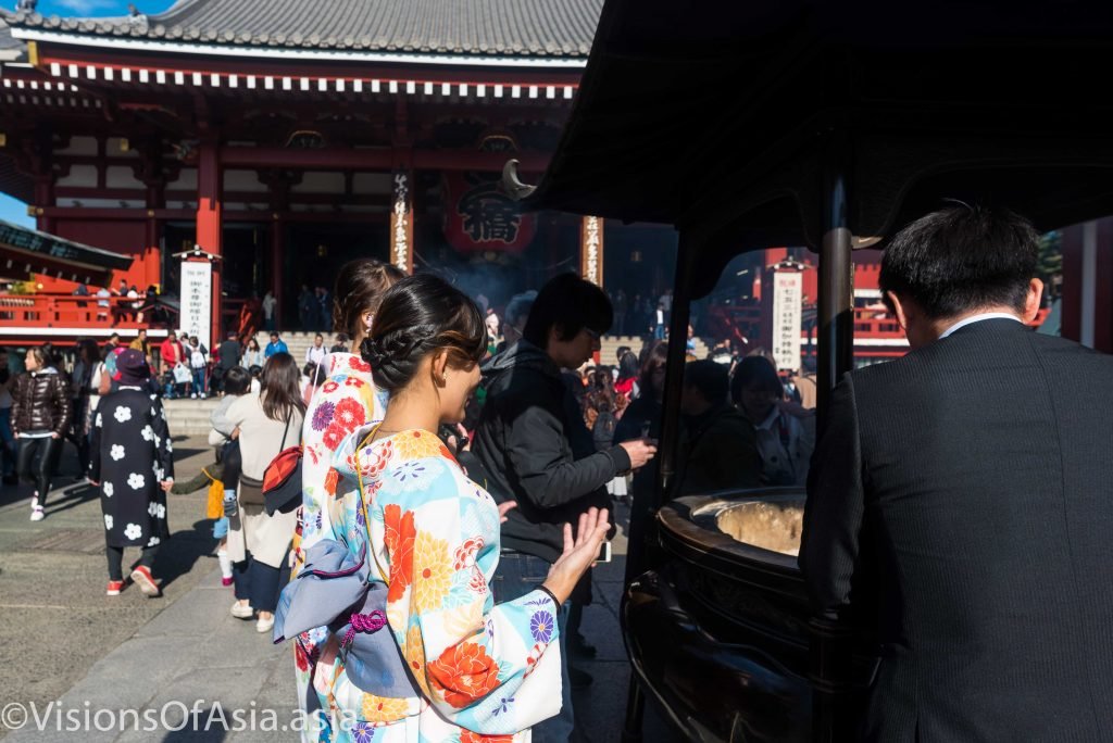 Asian tourists in Yukata in front of senso-ji