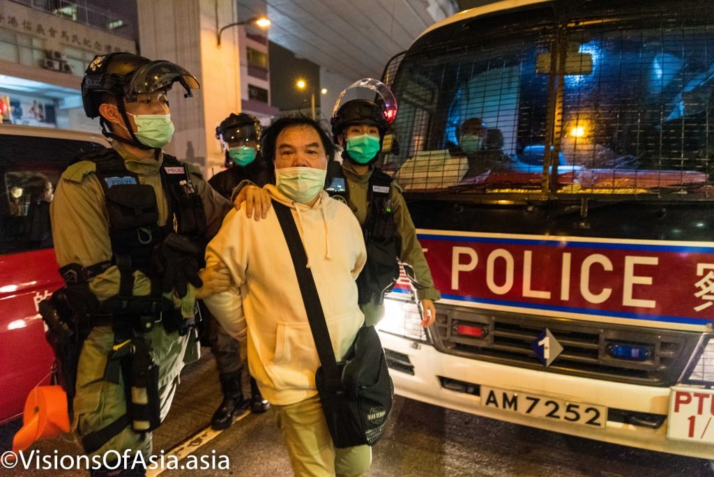 hong Kong, China, 31 Mar 2020,  A man is arrested by riot police near Prince Edward station.