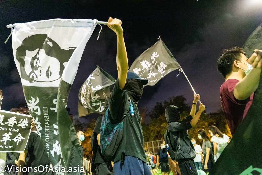 Protesters march with independence flags 