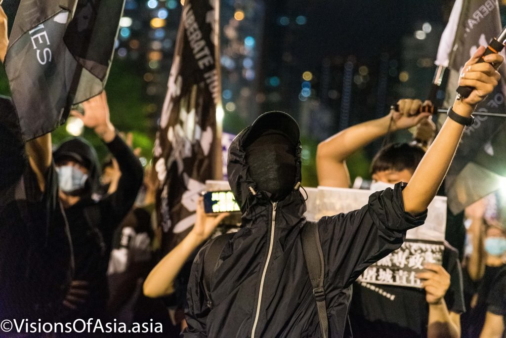 A protester completely masked