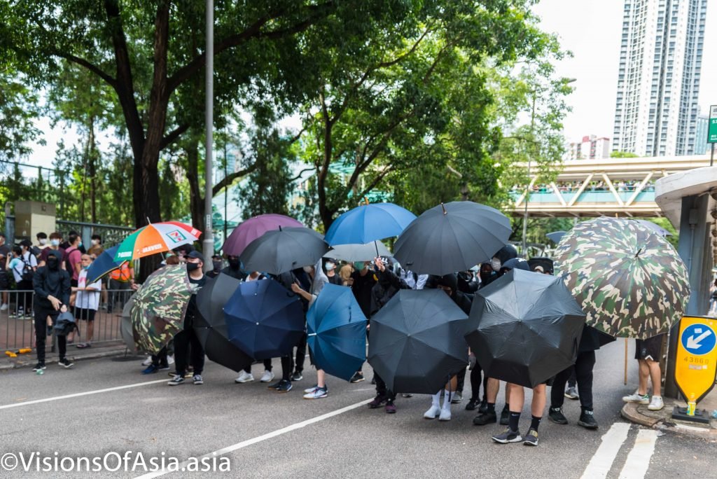 Frontliners form an umbrella wall