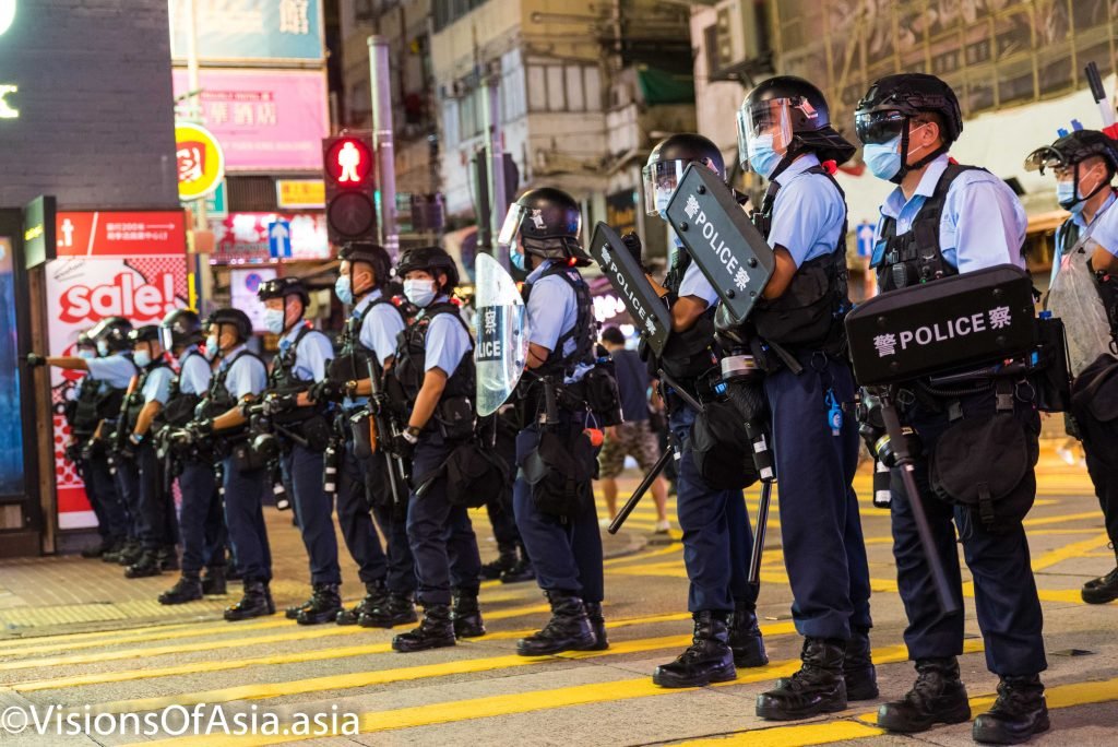 Riot police form a cordon in Sai Yeung Choi South street, in Mongkok