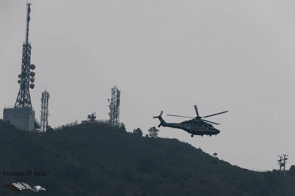 The GFS helicopter flying near the Radio tower of Kowloon Peak