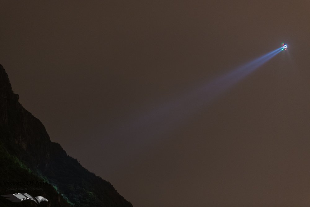 The GFS helicopter illuminates Kowloon Peak