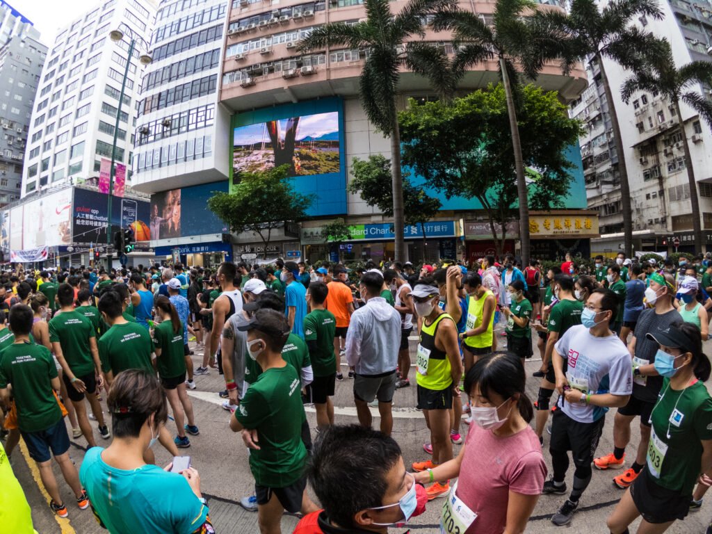 Hong Kong, China, 24 Oct 2021, Runners congregate on Nathan road ahead of their staggered start.