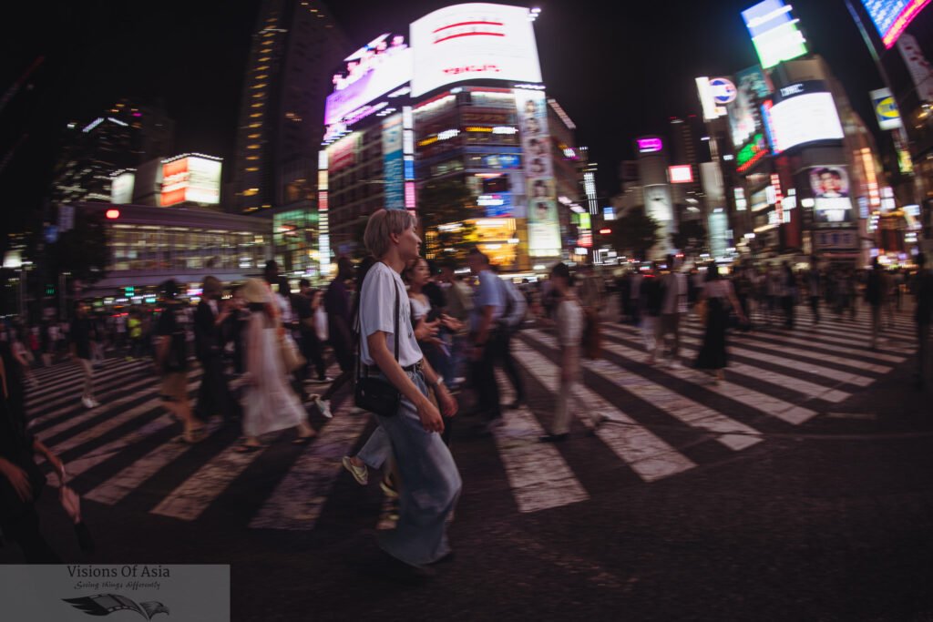 People cross the scrambled crossing of Shibuya in this panned shot.