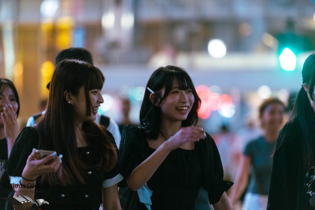 Two young ladies cross the Shibuya scrambled crossing